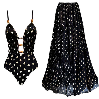 Maillot de bain une pièce à pois noirs et dorés avec col en V et jupe
