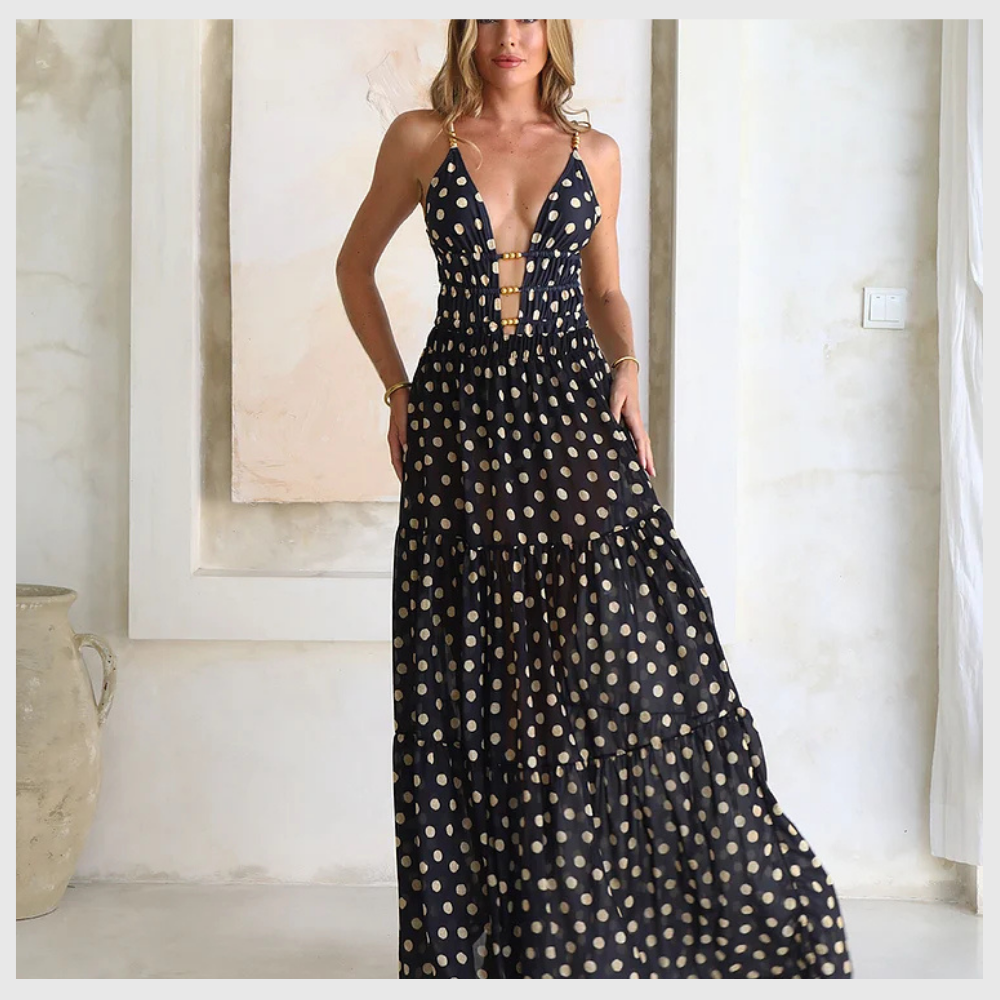 Maillot de bain une pièce à pois noirs et dorés avec col en V et jupe